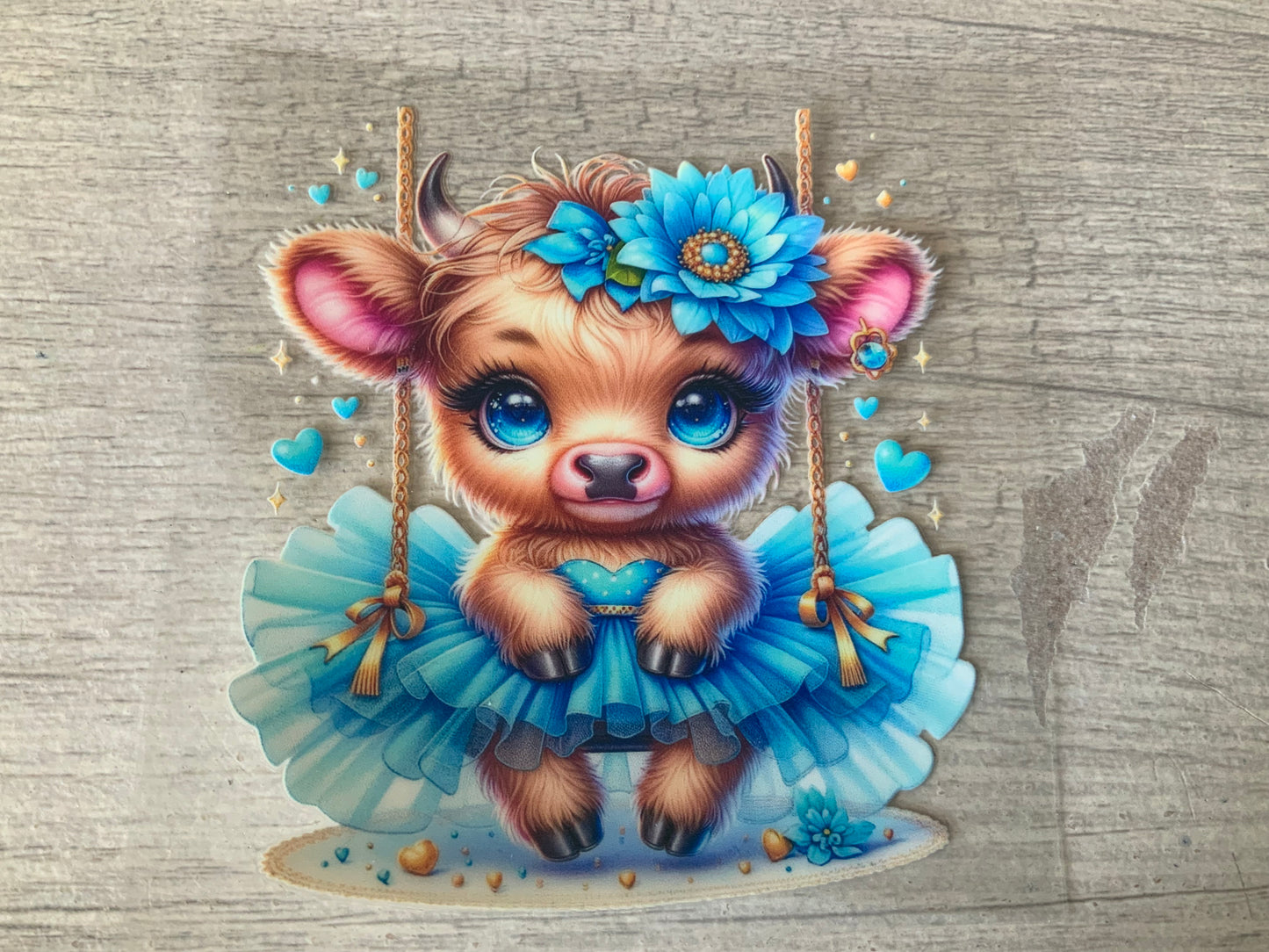Cow blue in a swing