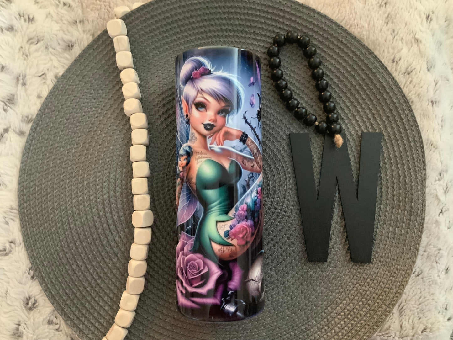 Tink tatted with skulls
