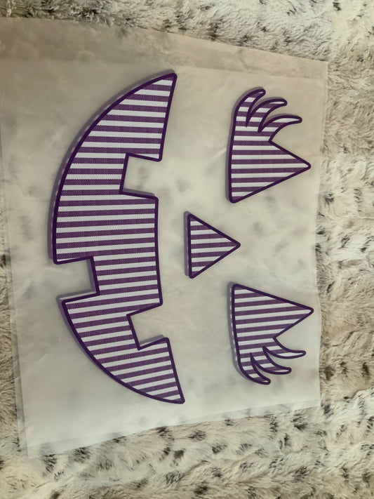 Pumpkin face purple stripes