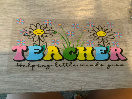 Teacher helping little minds